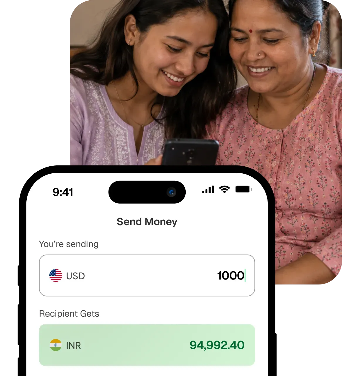 Two women smiling at a phone showing a Xuno USD to INR transfer